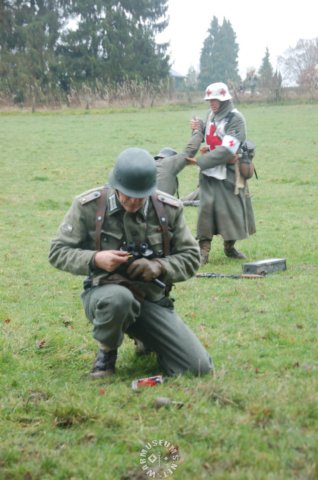 germanofficerwithtankdestructionbadgesilverandgermanmedic.jpg