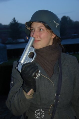 luftwaffeflakhelferinoftheantiaircraftgunauxiliarywithflaregun.jpg