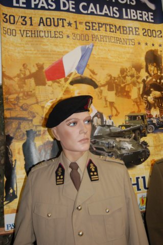 belgiansoldierwithpanelonreenactmentofcalaisliberation.jpg