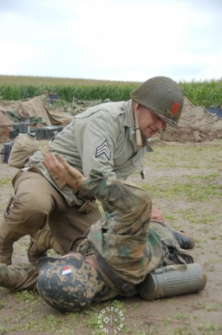 ussoldierpokingaroundhisprisoner.jpg